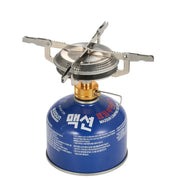 Outdoor camping gas stove with blue canister and metal pot supports