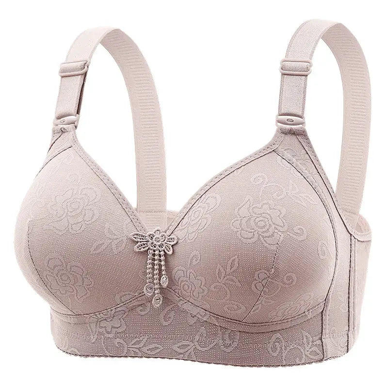 Nude pink lace bra with floral embroidery and adjustable straps