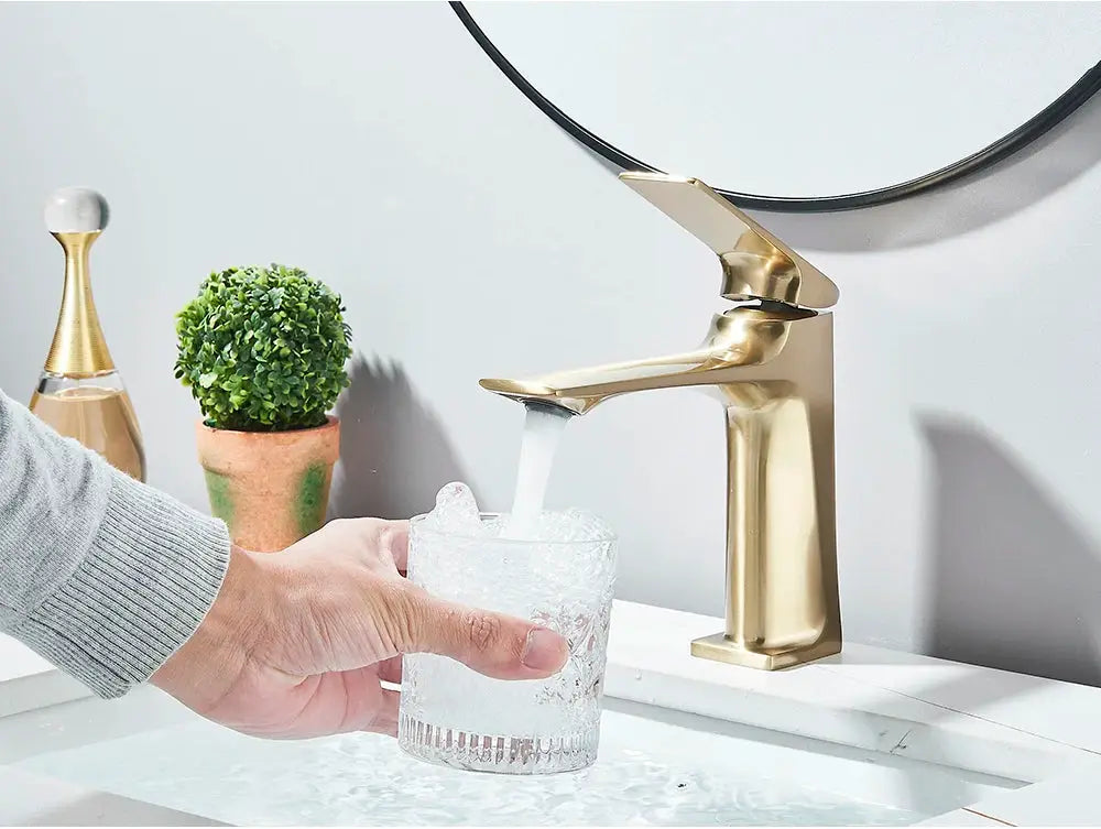 Brushed gold deck-mounted bathroom faucet with a single-lever basin tap