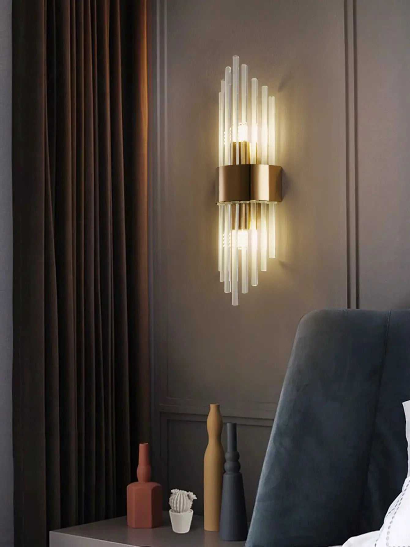Gold and black crystal wall sconce with vertical glass tubes by Simples Market, G9 light source.