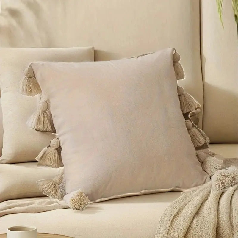 Beige solid decorative throw pillow cover with tassel trim for couch or bed