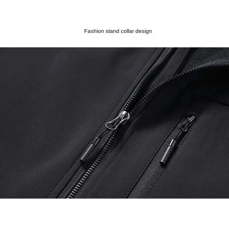 Soft-shell black vest with dual zippers and zipper pulls close-up