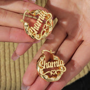 Gold-tone custom name hoop earrings, pair with twisted hoops and scripted name
