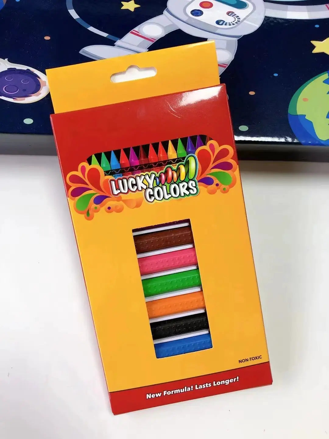 12-color wax crayon set by Simples Market in yellow box with window displaying colorful crayon sticks