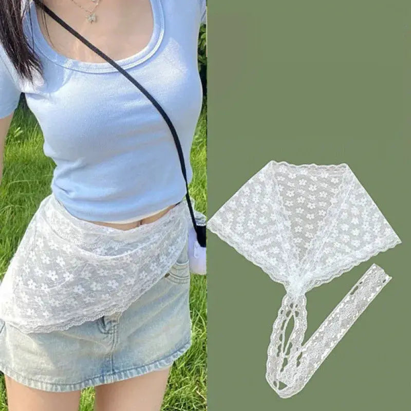 White lace layered gauze waist skirt with floral trim, worn over denim shorts
