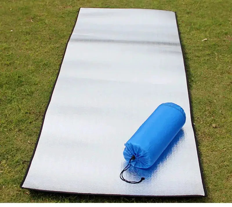 Camping mat by Simples Market, silver reflective foil sleeping pad with blue carry bag
