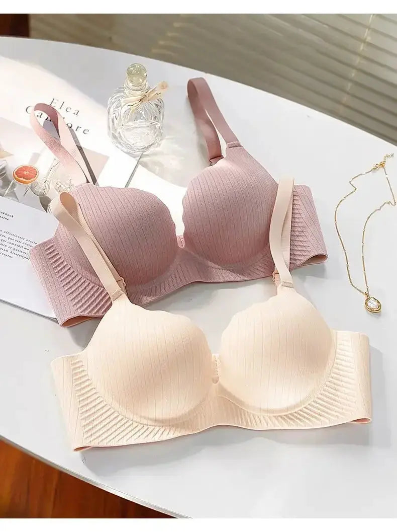 Padded push-up bras, two ribbed beige and pink styles with 6cm padding, no steel underwire.