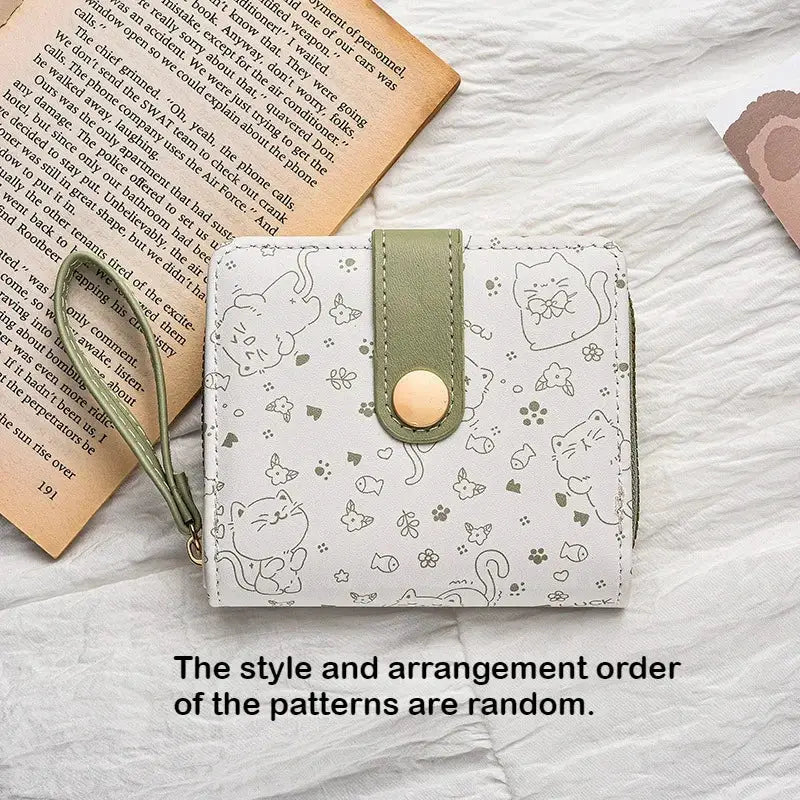 Japanese cute cat girls wallet with green strap and gold snap closure, white background, card and coin holder