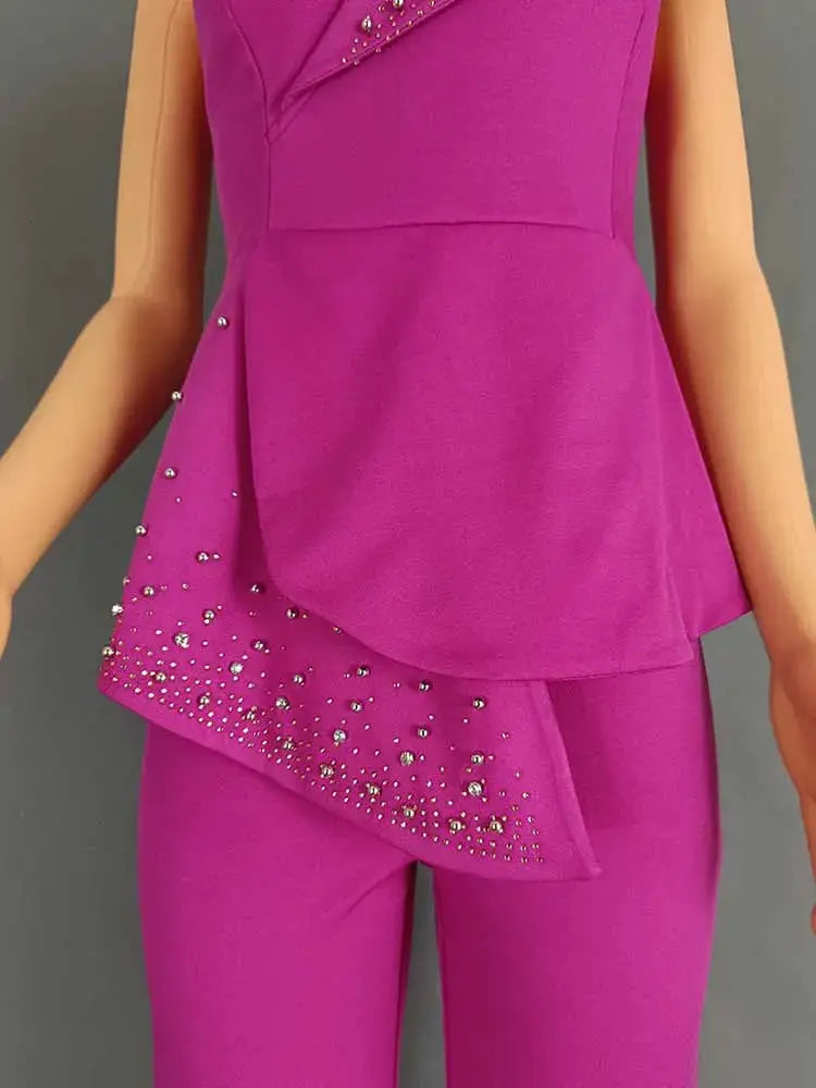 High waist strapless jumpsuit in magenta with rhinestone studded asymmetric overlay panel
