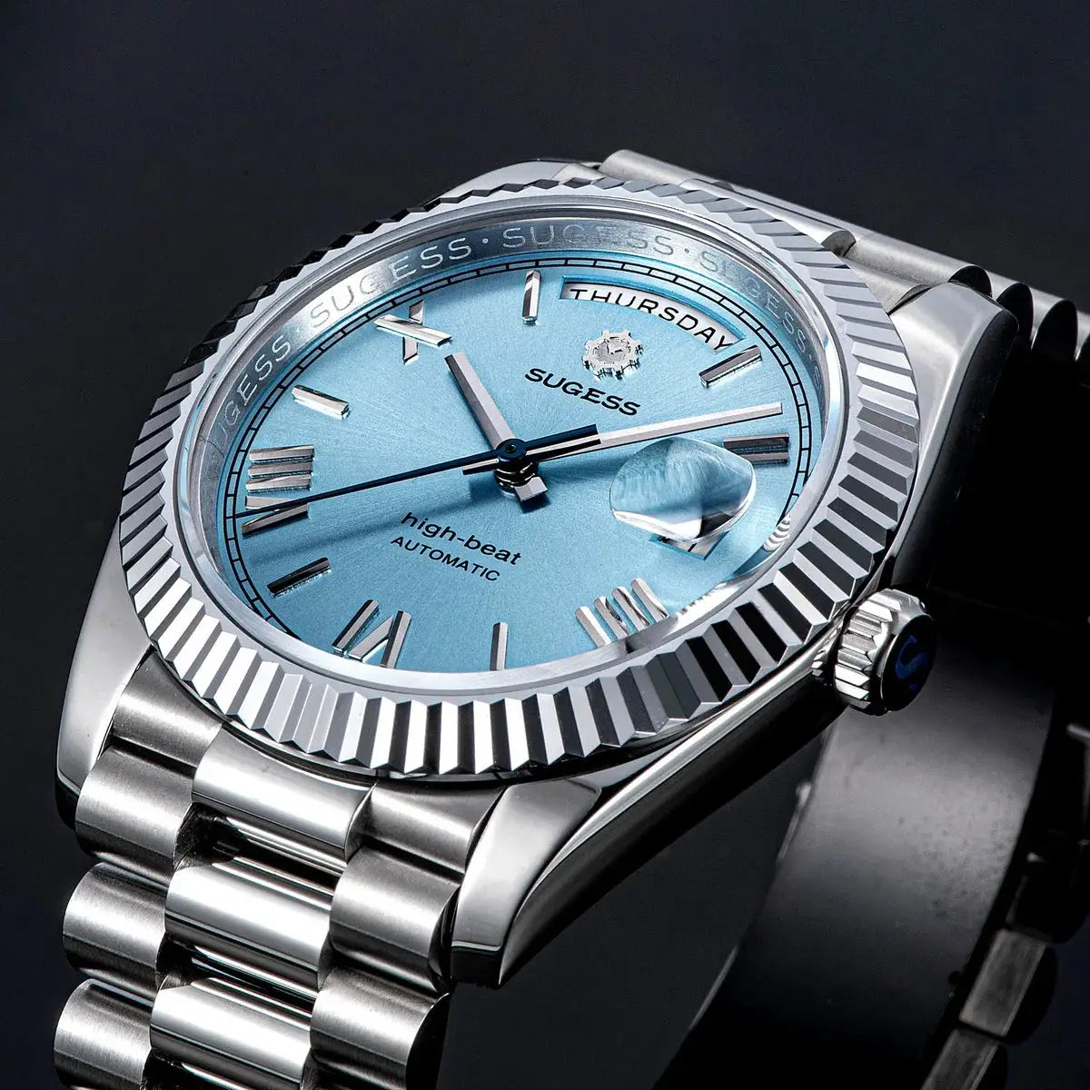 Sugess men's wristwatch with blue dial, stainless steel case and bracelet, day/date window, automatic movement.