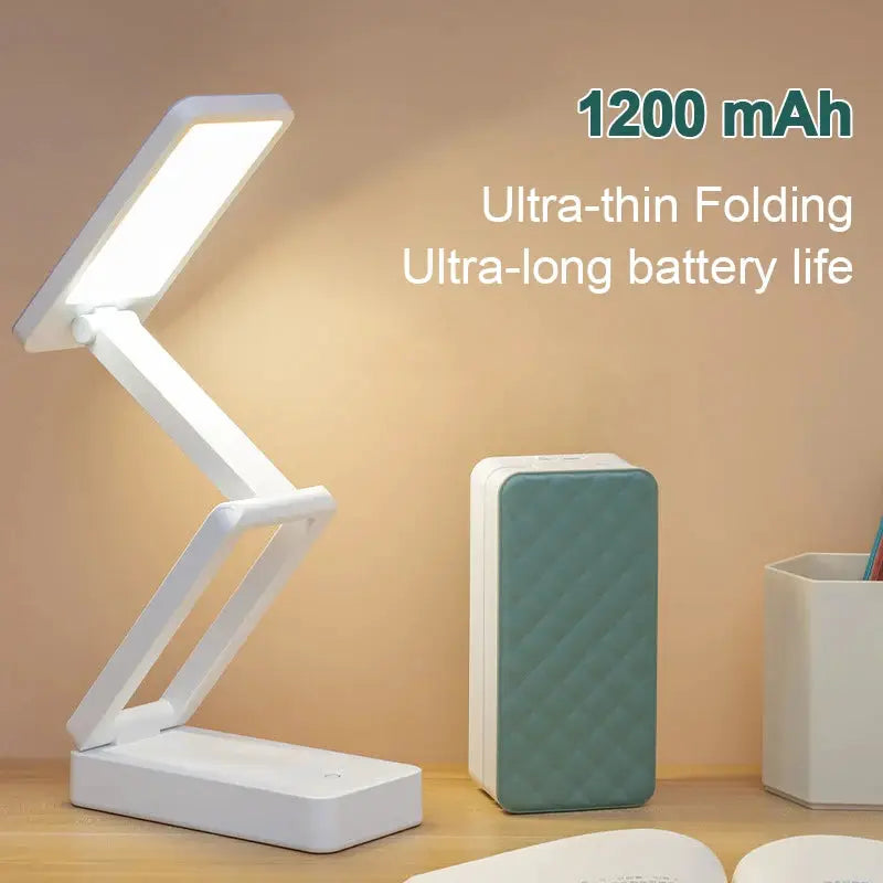 Folding LED Desk Lamp with 1200 mAh battery; white, ultra-thin foldable design, shown with teal power bank