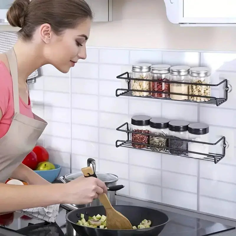 Iron wall-mounted two-tier spice rack with glass jars in a kitchen by Simples Market