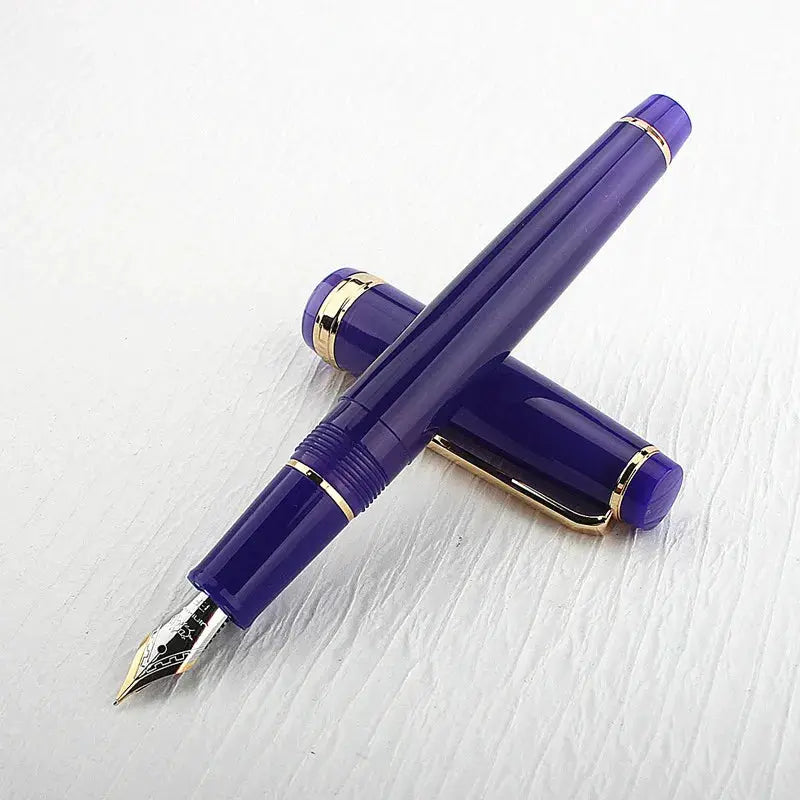 Jinhao 82 fountain pen in purple acrylic with gold trim and converter.
