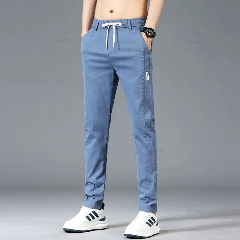Men's casual pants with elastic drawstring waist in blue-gray, slim straight fit, front pockets, spring/summer style.
