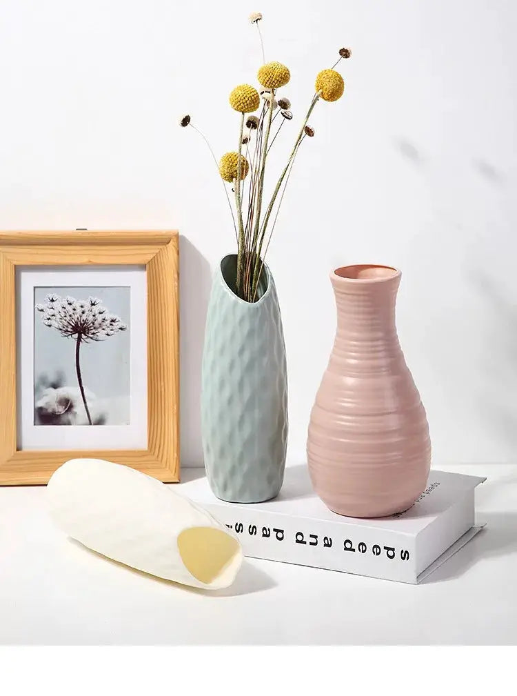 Nordic plastic vase set; blue textured vase and pink ribbed vase with dried stems Simples Market