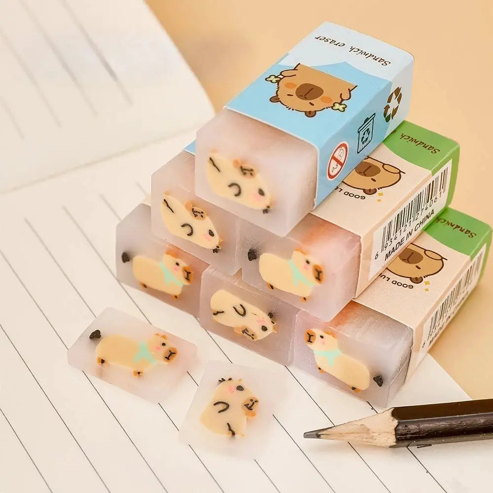 Kapibara eraser set from Simples Market with pastel cartoon capybara faces on translucent blocks for primary school