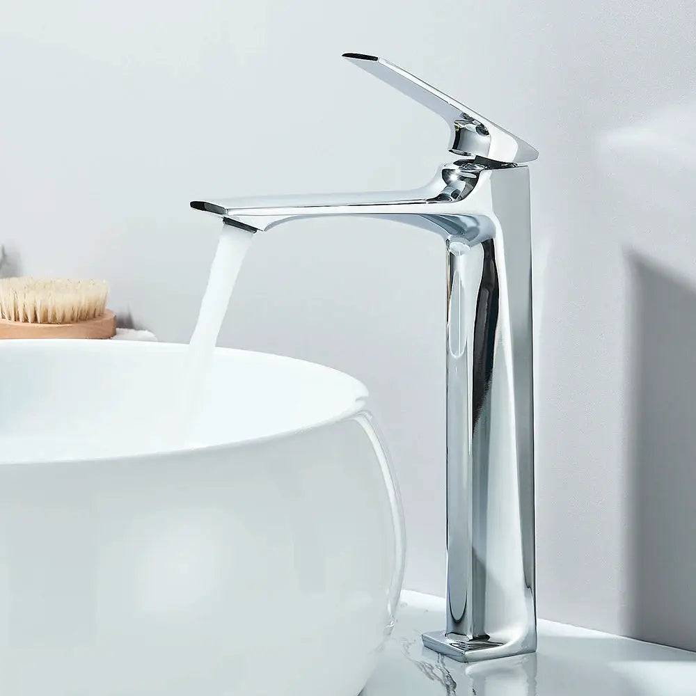 Chrome-finish deck-mounted bathroom faucet with a single lever for basin sink.