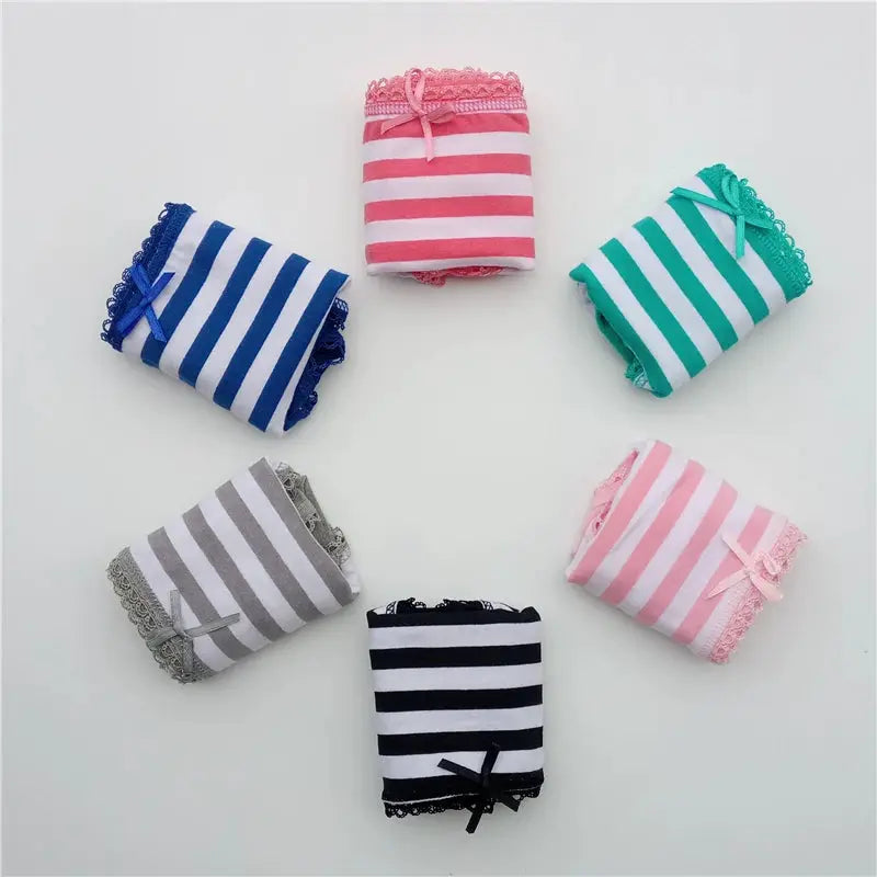 Six pairs of women's striped cotton panties with lace trim in assorted colors