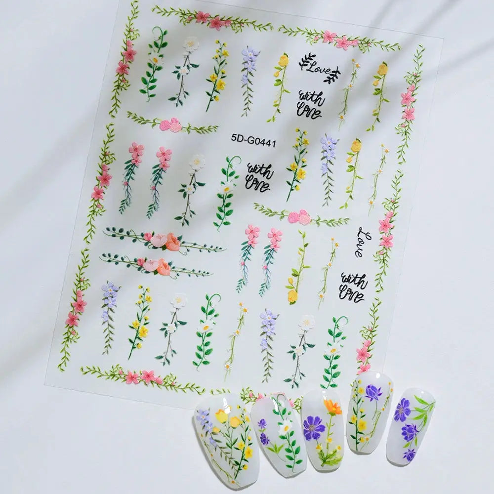 Nail sticker sheet with pastel floral borders and assorted flower decals for manicure decor