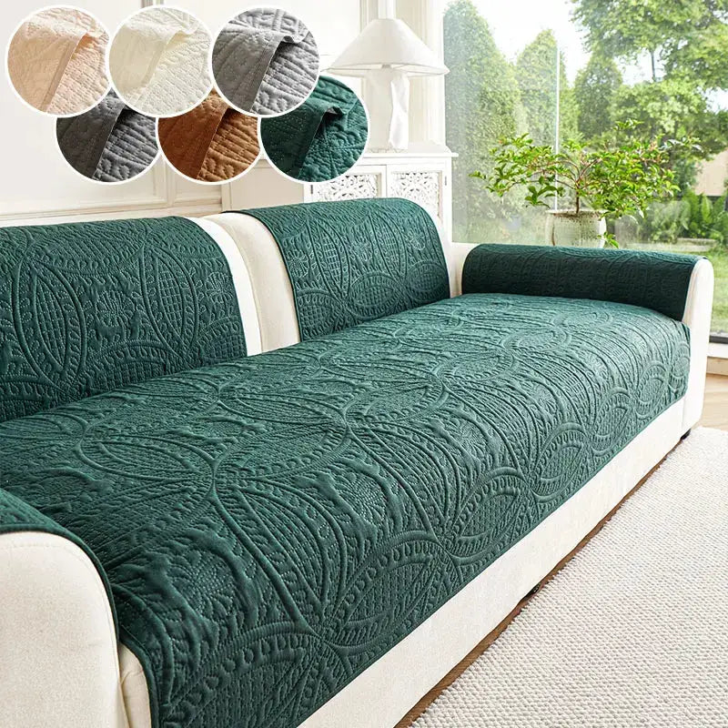 Quilted green sofa cushion cover on a white sofa with round color swatches showing options.