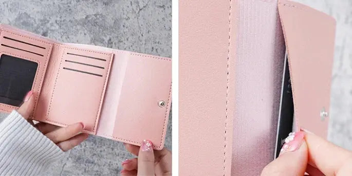 Pink wallet with snap closure, opened to show card slots and ID window.