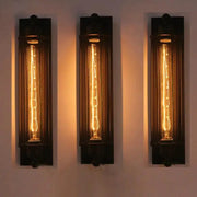 Set of three retro industrial iron wall lights with vertical LED filament bulbs for hallway or loft decor