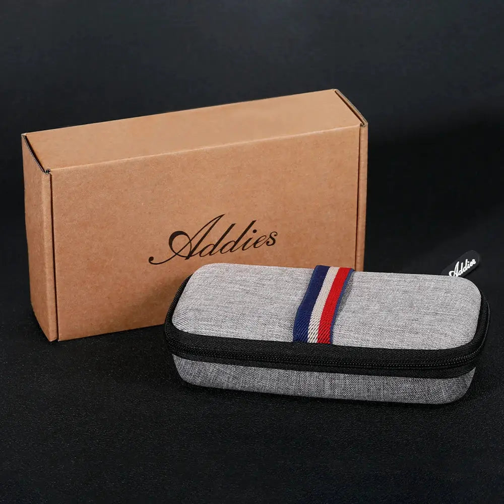 Adddies luxury women's watch packaging with grey zip case and red/blue stripe beside Simples Market box