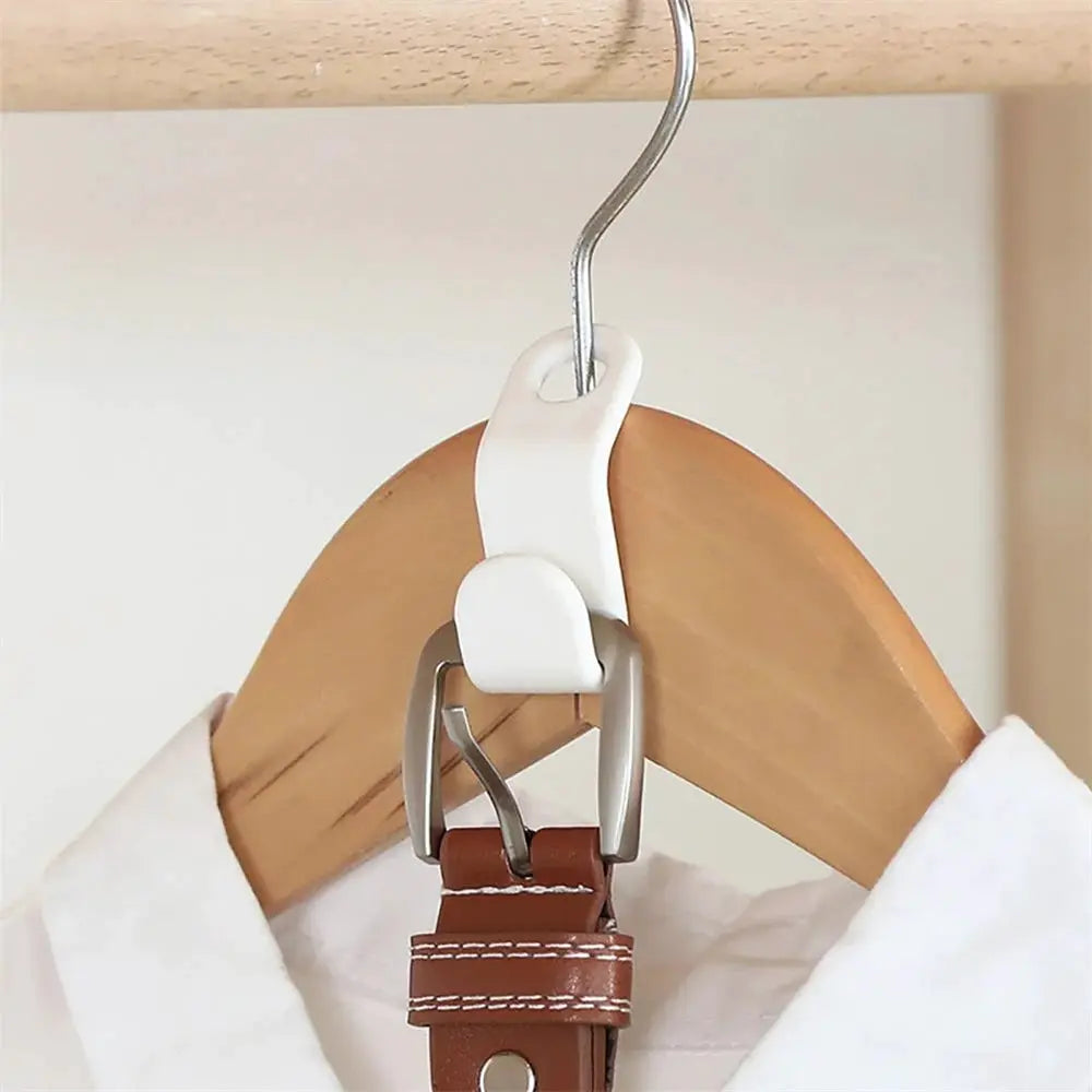 Mini wardrobe connector hanger in white plastic with metal hook, on a wooden hanger with brown leather strap.