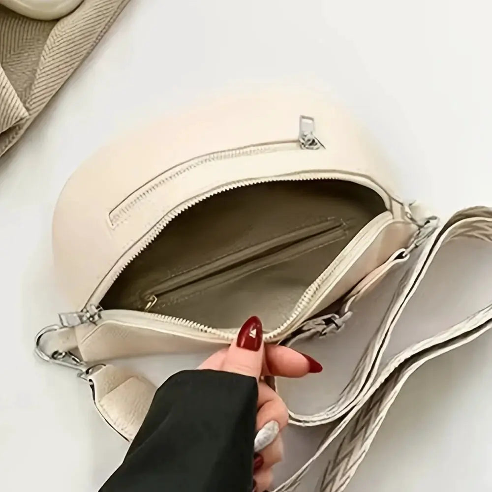 Beige soft leather fanny pack crossbody bag with zippered main compartment and inner pocket.