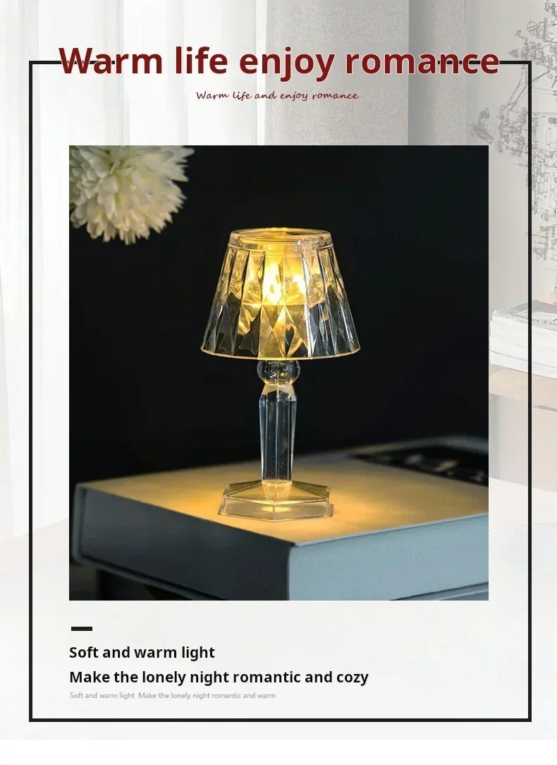 Mini crystal table lamp with a diamond-cut shade and clear glass base, emitting warm LED light.