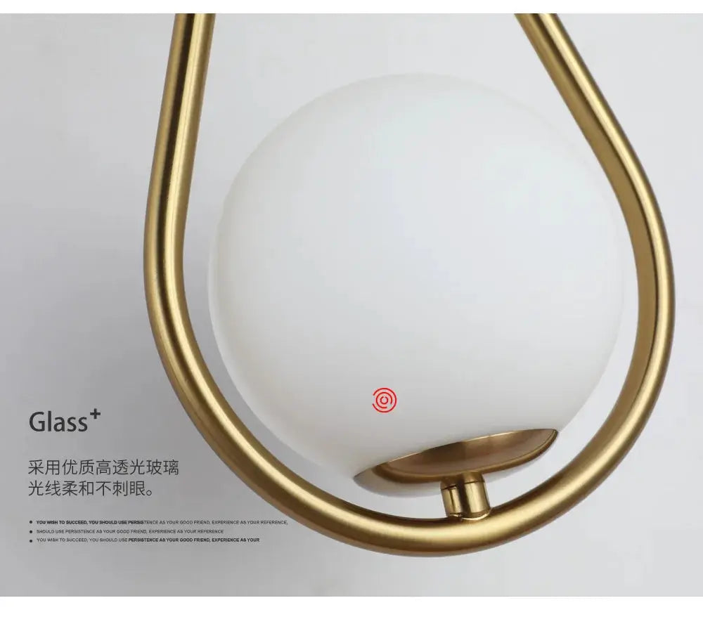 Nordic Glass Ball LED Wall Lamp by Simples Market; white glass ball with a gold metal frame for modern living spaces