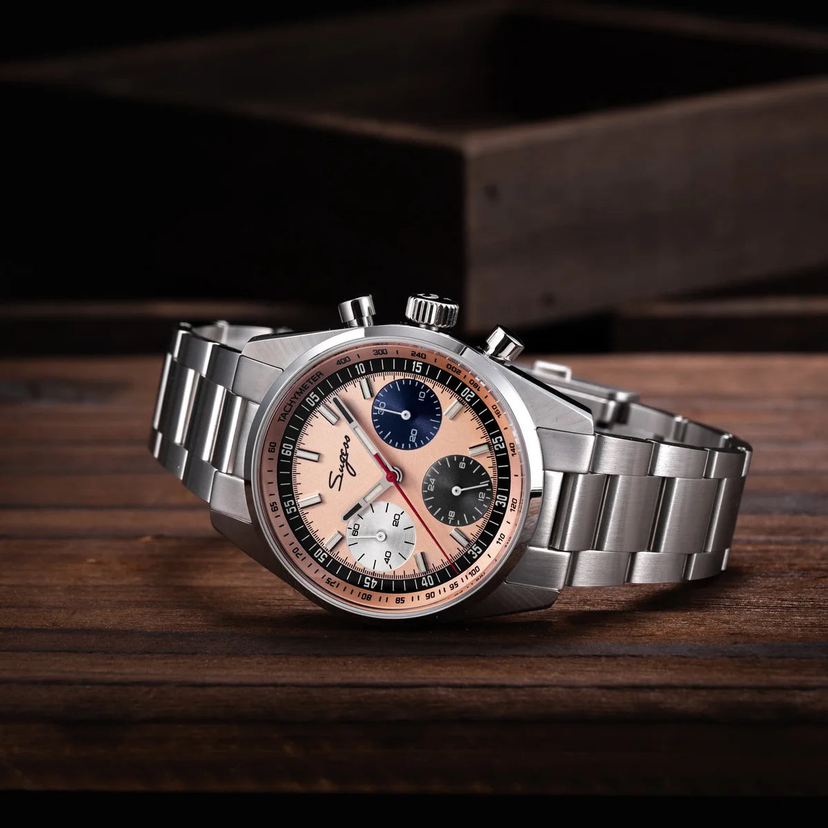 Sugess men's 38mm chronograph watch; stainless steel bracelet, peach dial with blue, white and black subdials and tachymeter bezel