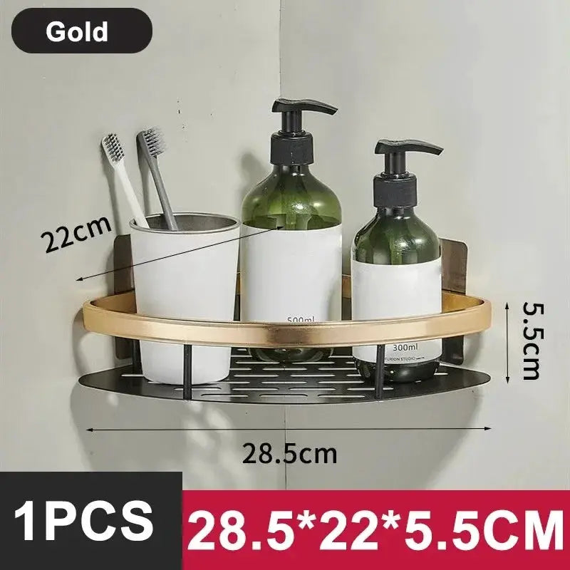 Bathroom shelf organizer in gold aluminum alloy with curved rail and perforated base, holding two pump bottles.