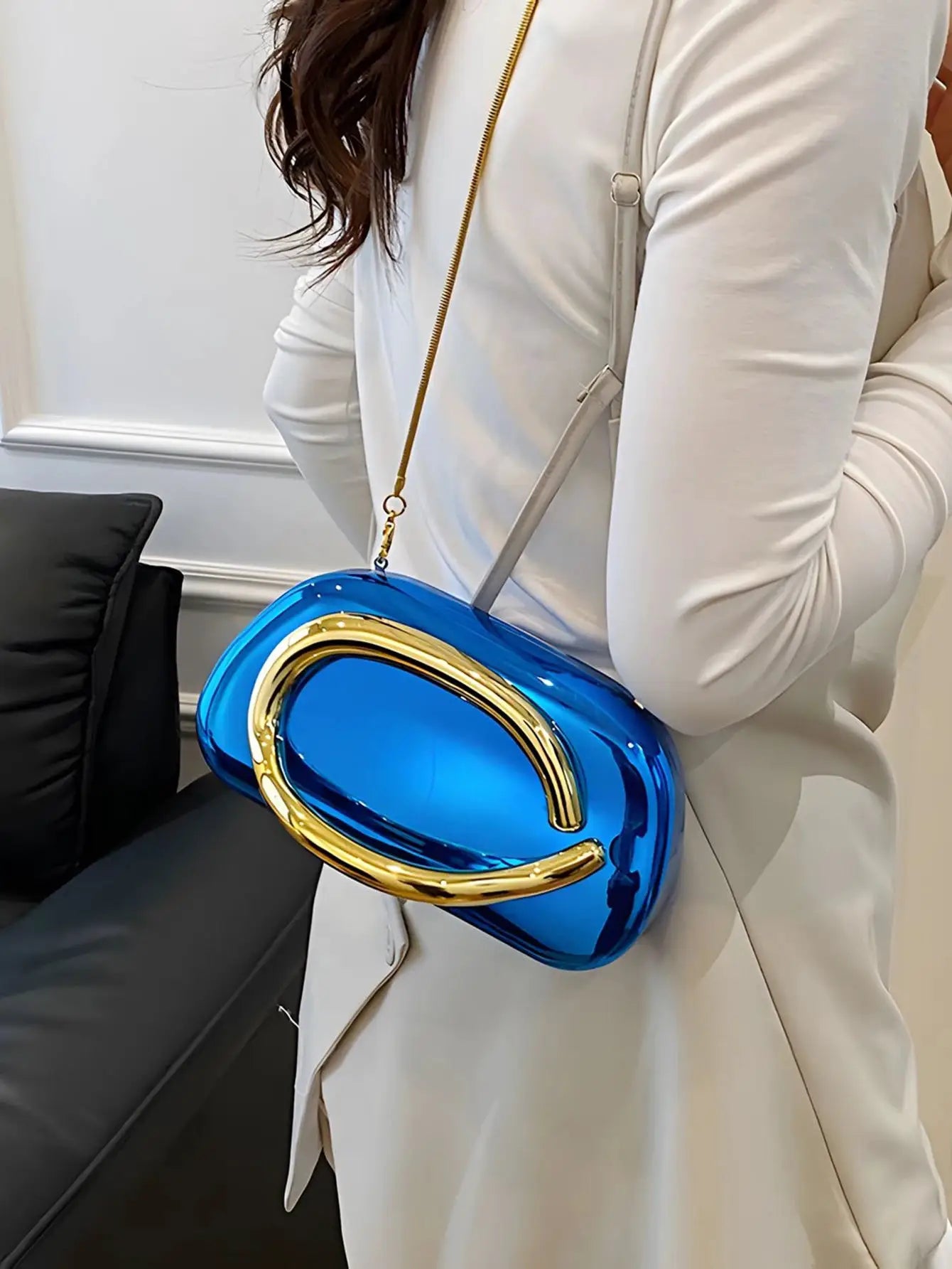 Acrylic box crossbody bag by Simples Market in blue with gold arch hardware.