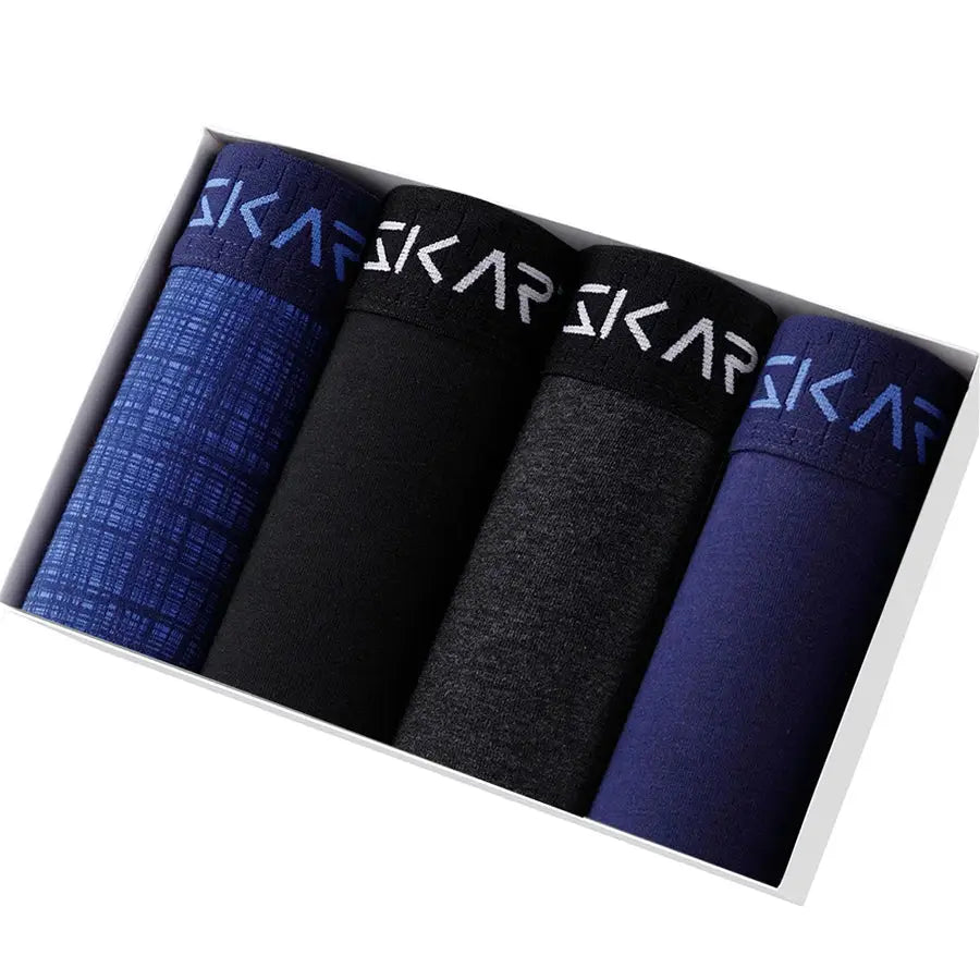 4-pack cotton men's boxer shorts by Simples Market with Sakar waistband; blue, black, charcoal, and navy.