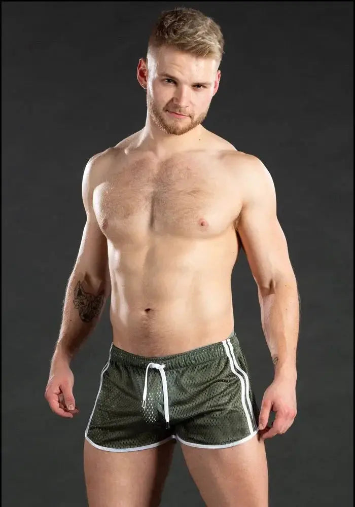 Men's green grid-pattern mesh gym shorts with white trim and drawstring