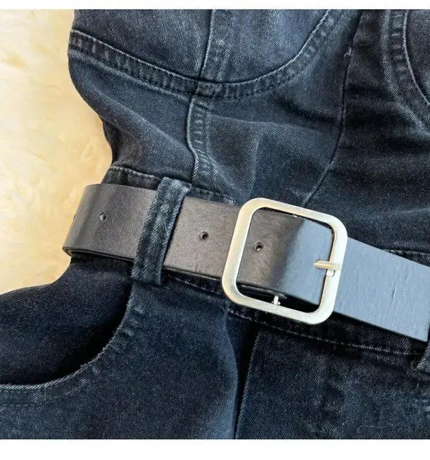 Denim romper waist belt close-up in dark blue with silver buckle