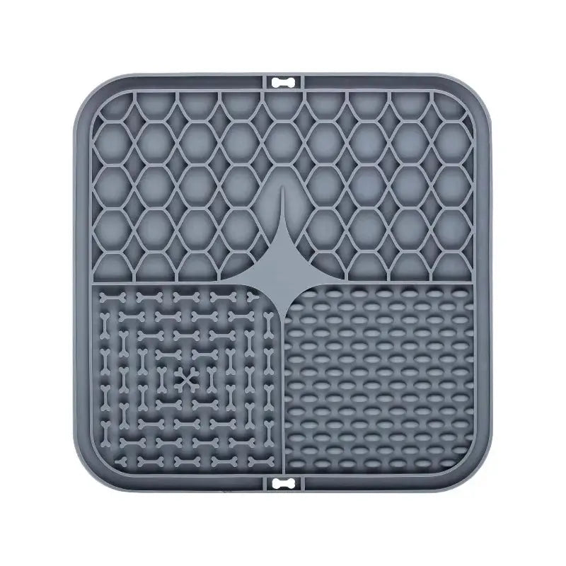 Gray silicone lick mat for dogs by Simples Market with three textured zones honeycomb, bone, and raised-dots for feeding