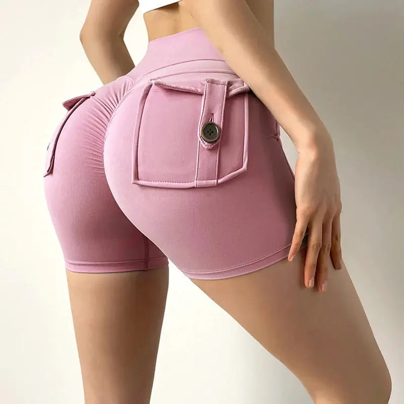 Fitness shorts in peach with back cargo pocket and button