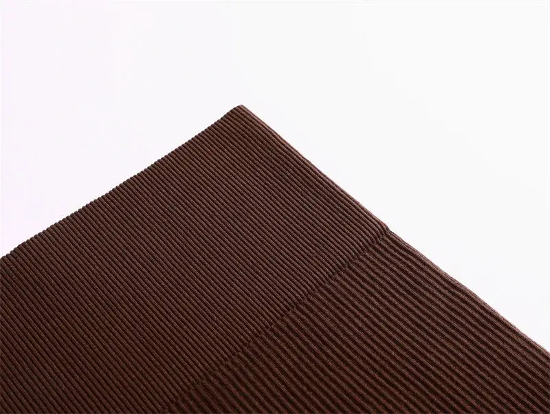 Women's high-waist pencil skirt fabric close-up in brown ribbed material