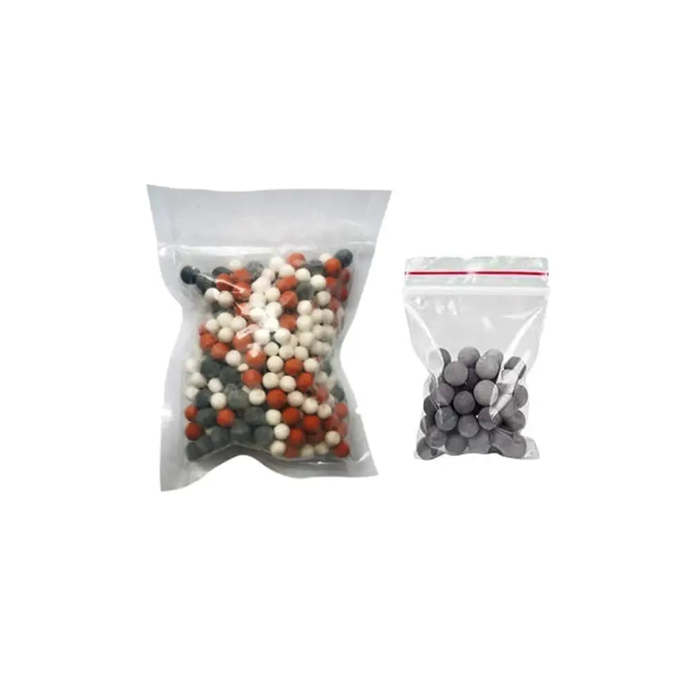 Shower filter beads; two resealable bags with multicolor ceramic beads (orange, white, gray) and gray beads.
