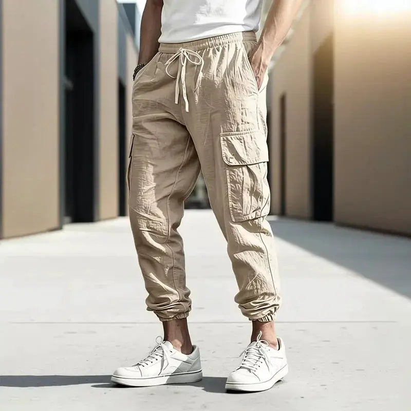 Men's cotton-linen cargo jogger pants in beige with elastic cuffs, drawstring waist and multiple pockets