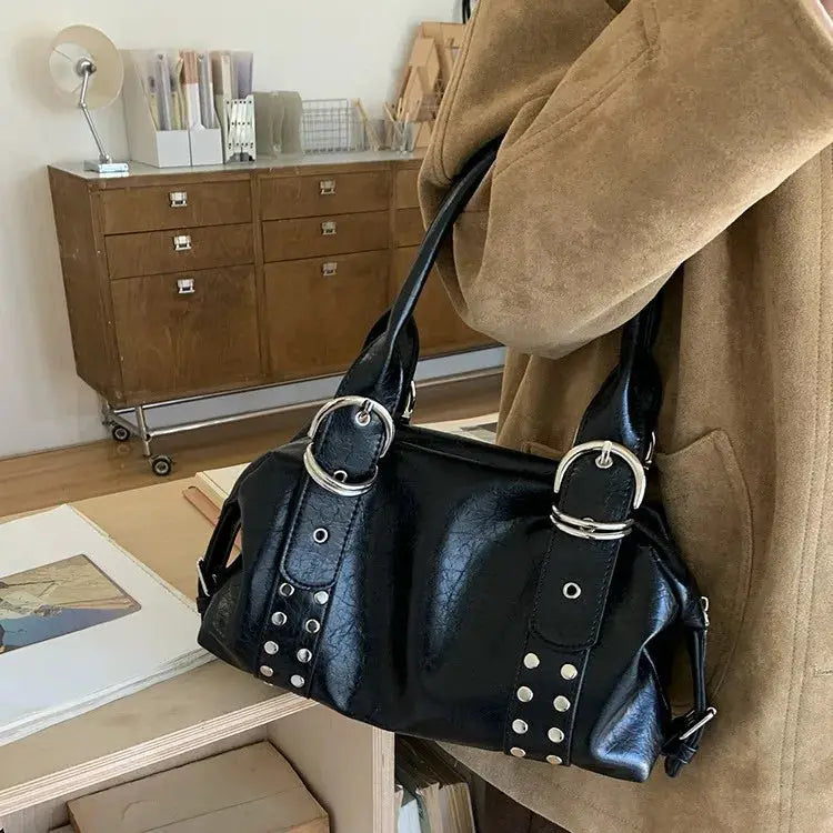 Black PU leather rivet shoulder bag with silver-tone rings and studded straps.