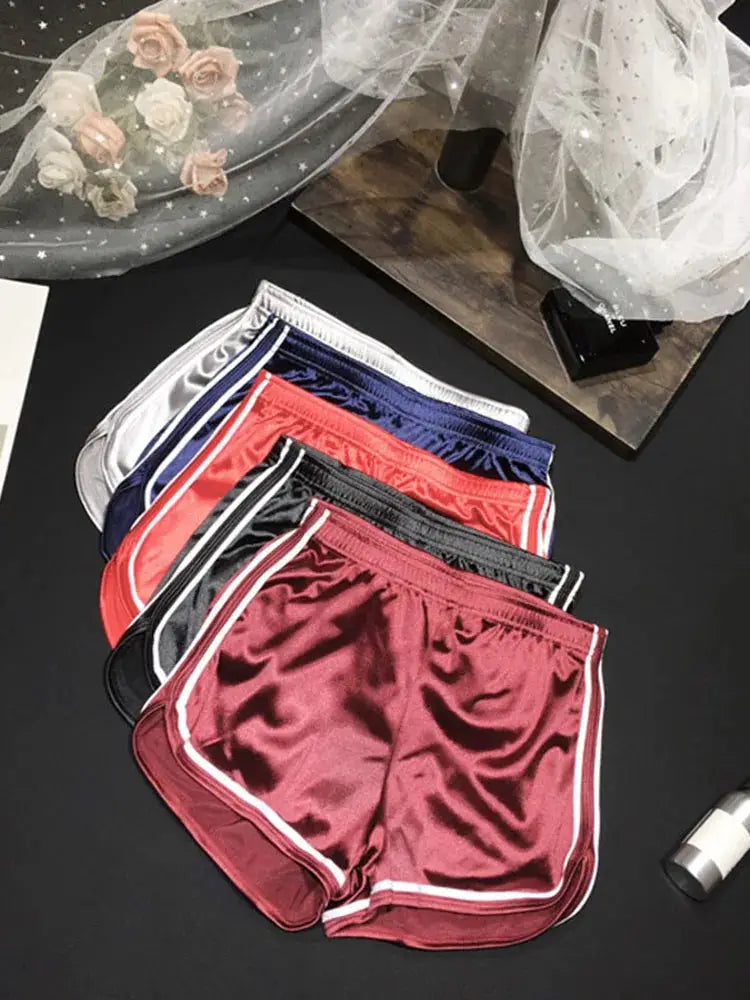 Women's silk shorts in white, navy, red, black and maroon with white piping; five pairs