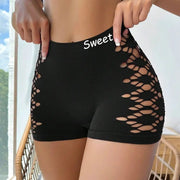 Seamless black sports shorts with side hollow-out mesh panels for under-skirt wear