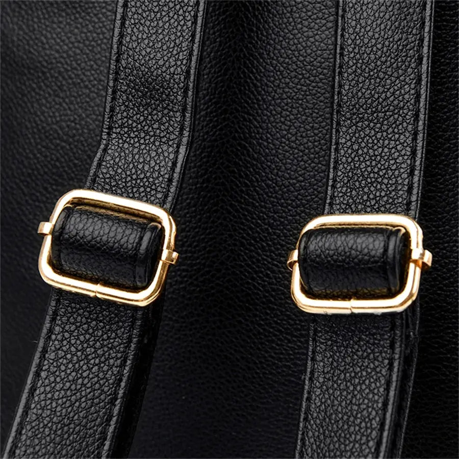 Leather backpack with black pebbled straps and gold-tone buckle hardware