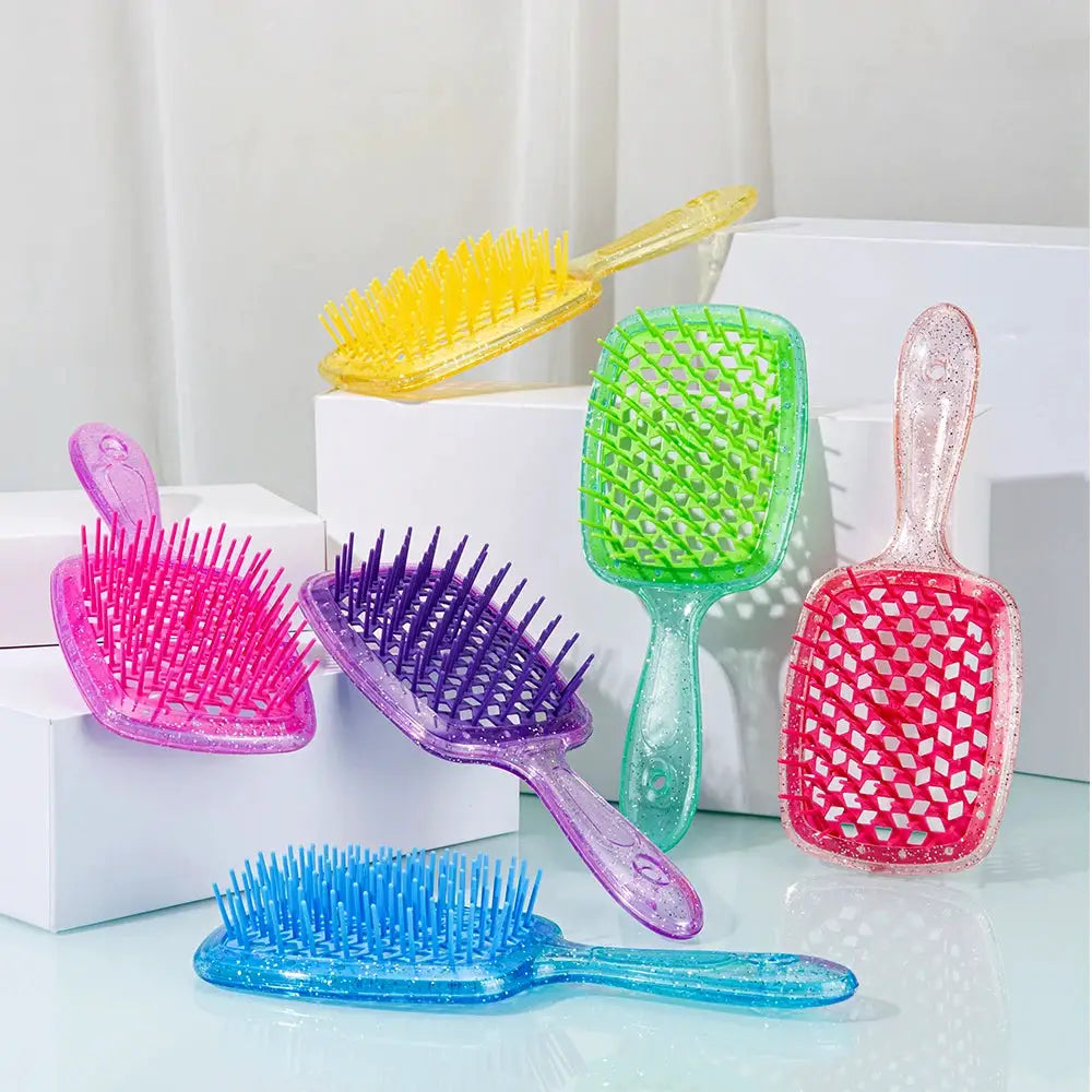Six-piece detangling hair brush set in bright yellow, pink, purple, blue, and green with hollow-out grid bristles
