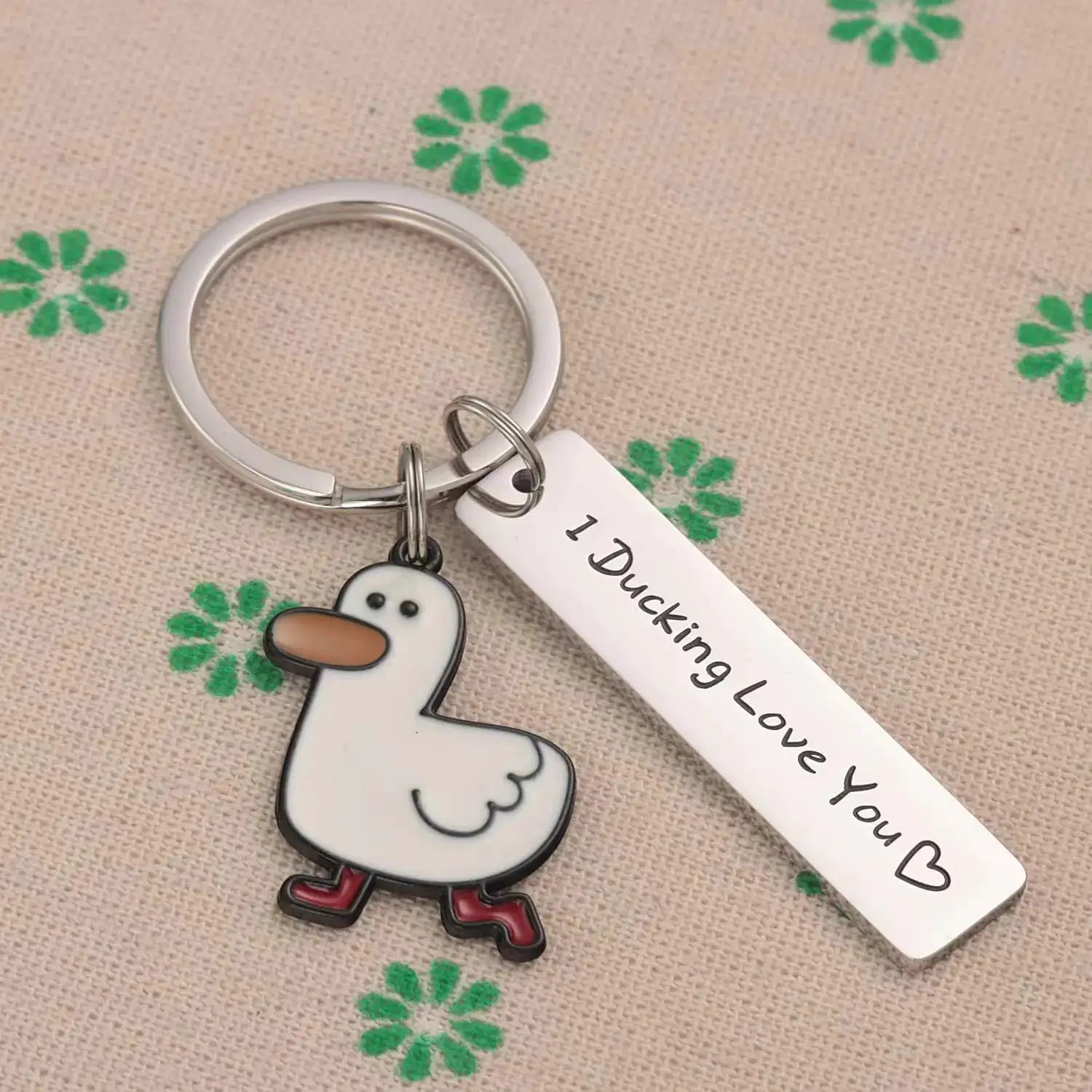 Funny duck pun keychain with cartoon duck charm and a white tag reading I Ducking Love You