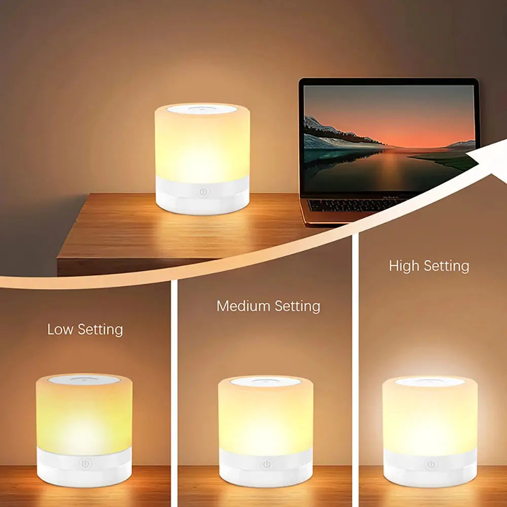 RGB Night Lamp color-changing bedside lamp with white base on a desk beside a laptop