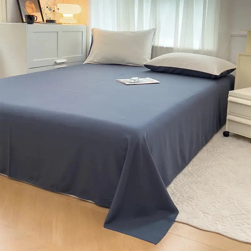 4-piece reversible navy brush-fabric duvet cover bedding set with pillowcases by Simples Market on a bed